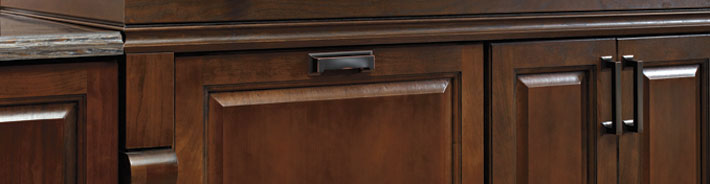 Close-up of Cherry wood cabinets with metal hardware